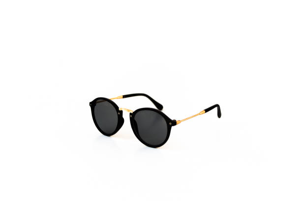 istock Black sunglasses with golden eyepiece 1143360979