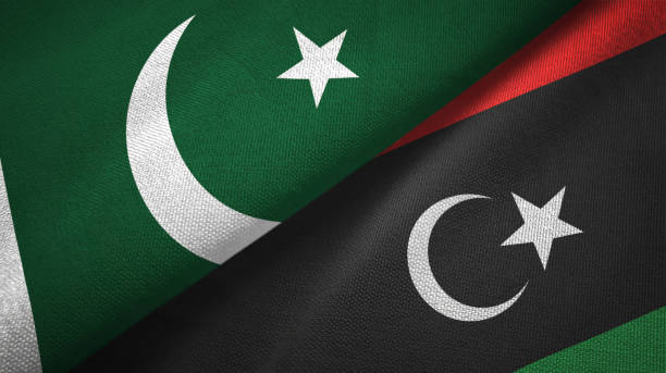 istock Pakistan and Libya two flags textile cloth, fabric texture 1143362058