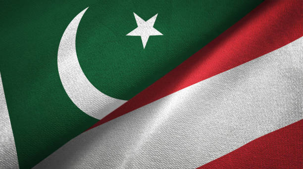 istock Pakistan and Austria two flags textile cloth, fabric texture 1143362071