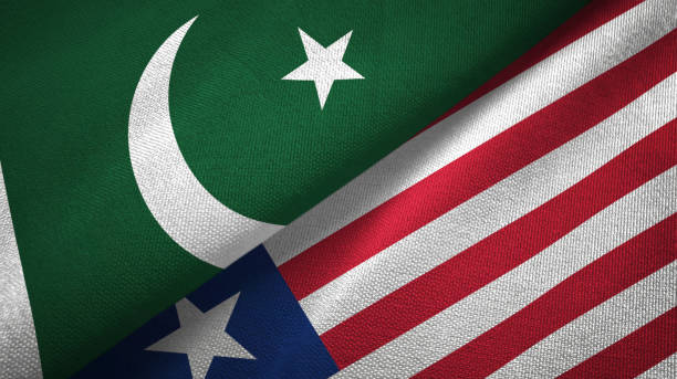 istock Pakistan and Liberia two flags textile cloth, fabric texture 1143362080