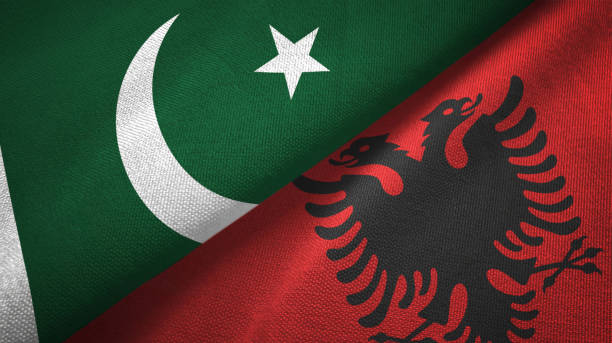 istock Pakistan and Albania two flags textile cloth, fabric texture 1143362091