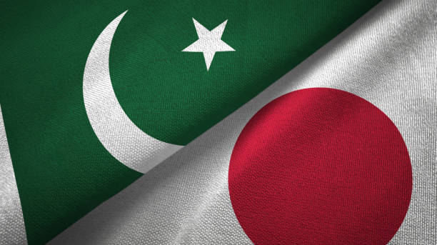 istock Pakistan and Japan two flags textile cloth, fabric texture 1143362181