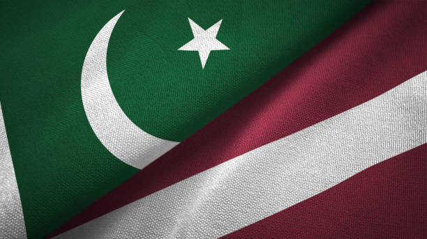 istock Pakistan and Latvia two flags textile cloth, fabric texture 1143362212