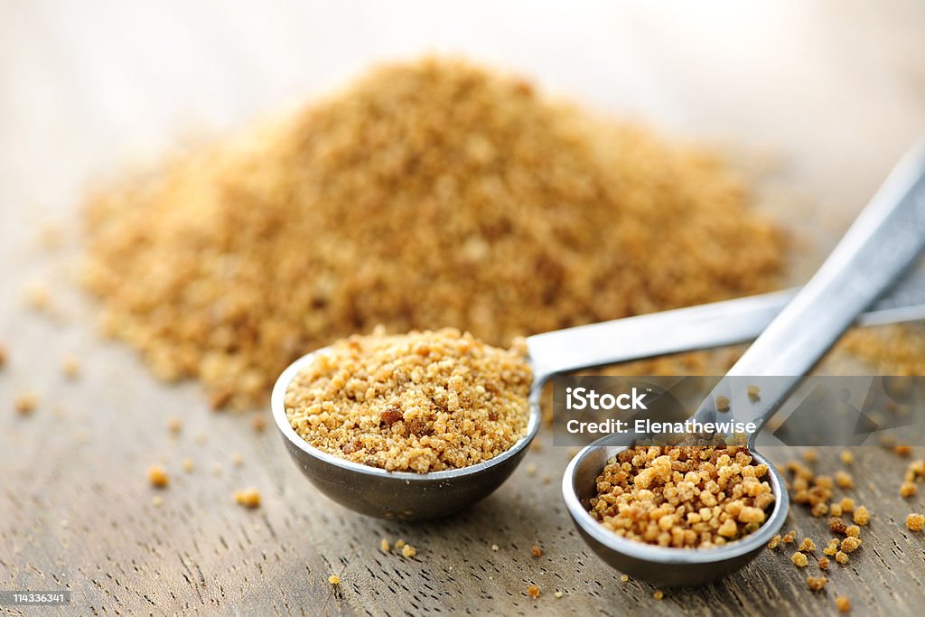 Coconut palm sugar in measuring spoons  Sugar - Food Stock Photo