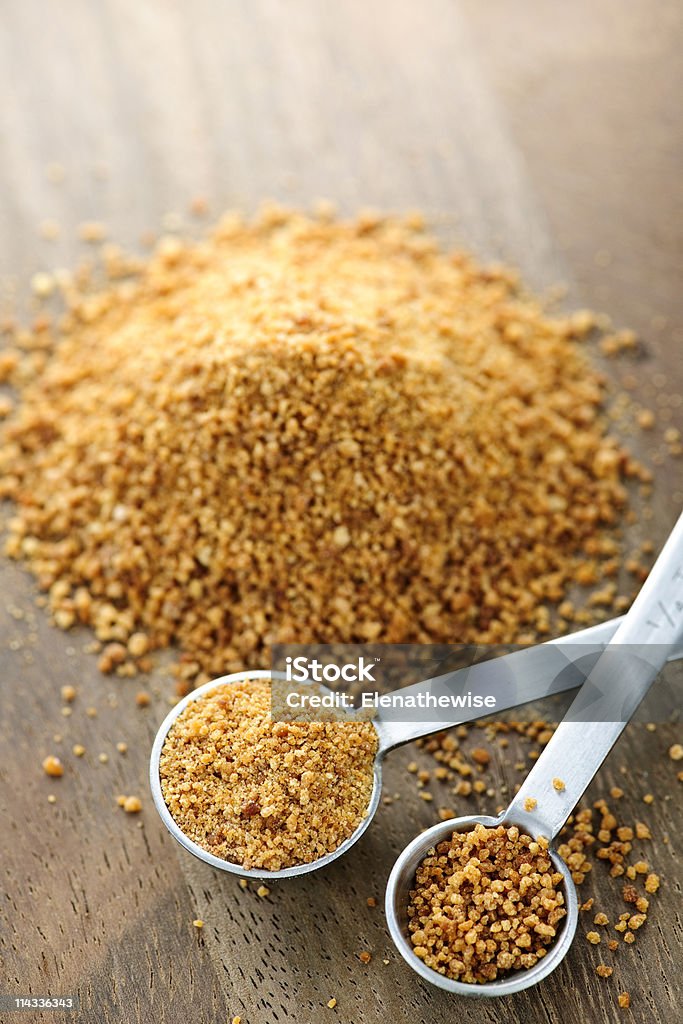 Coconut palm sugar in measuring spoons  Brown Stock Photo