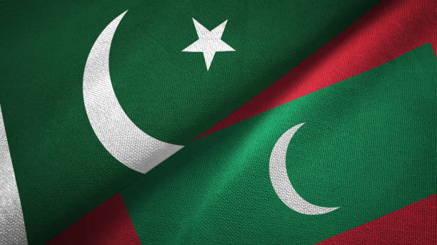 istock Pakistan and Maldives two flags textile cloth, fabric texture 1143363824