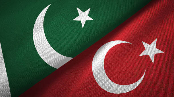istock Pakistan and Turkey two flags textile cloth, fabric texture 1143365003