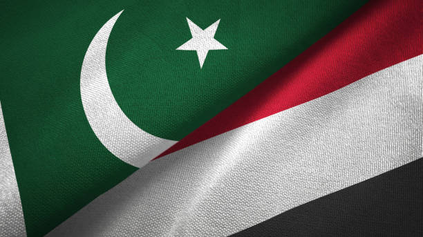 istock Pakistan and Yemen two flags textile cloth, fabric texture 1143365036