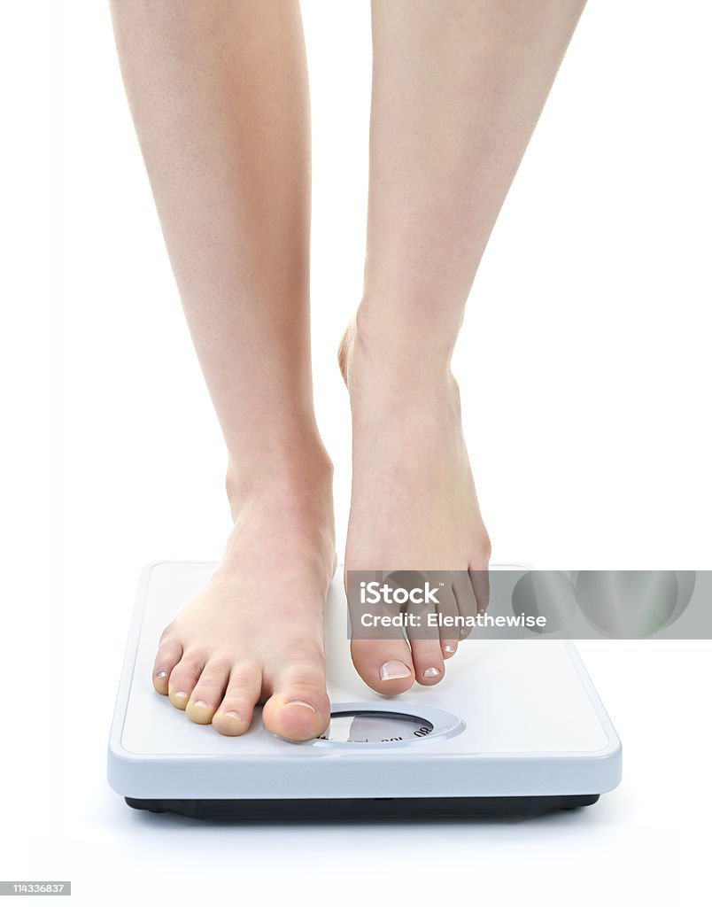 Feet on bathroom scale  Human Foot Stock Photo