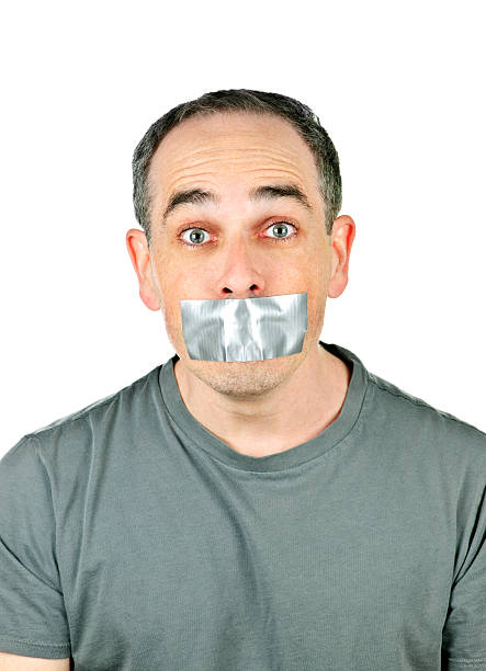 mann mit isolierband in mouth - human mouth duct tape covering adhesive tape stock-fotos und bilder