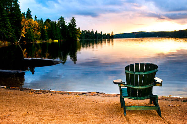 istock Wooden chair at sunset on beach 114337418