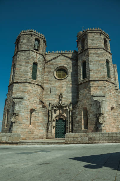 gothic facade with steeples at the guarda cathedral - religion christianity bell tower catholicism imagens e fotografias de stock