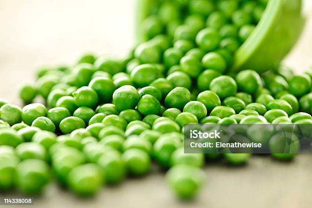 Spilled Bowl Of Green Peas Stock Photo - Download Image Now - Bowl, Close-up, Color Image