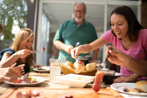 istock Friends picking some barbecue meat from cutting board 1143380113