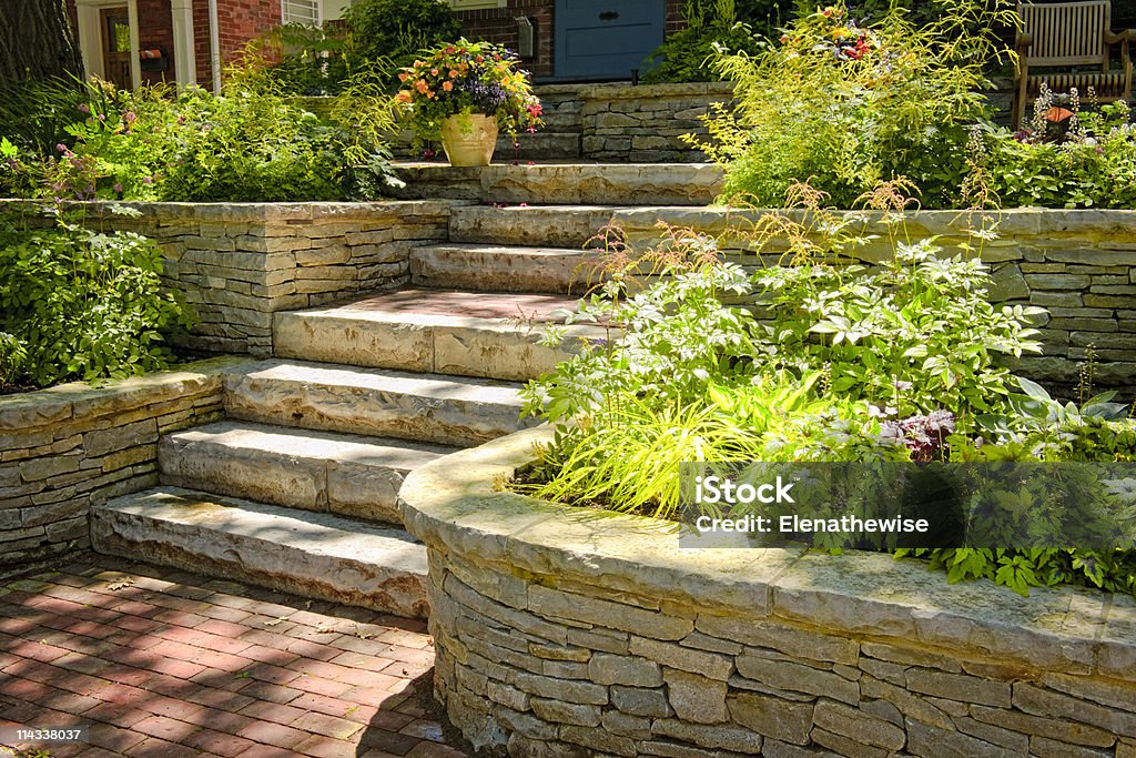 Natural stone landscaping Natural stone landscaping in home garden with stairs Stone Material Stock Photo
