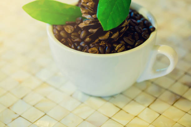 Roasted Coffee Beans And Blue Note Paper