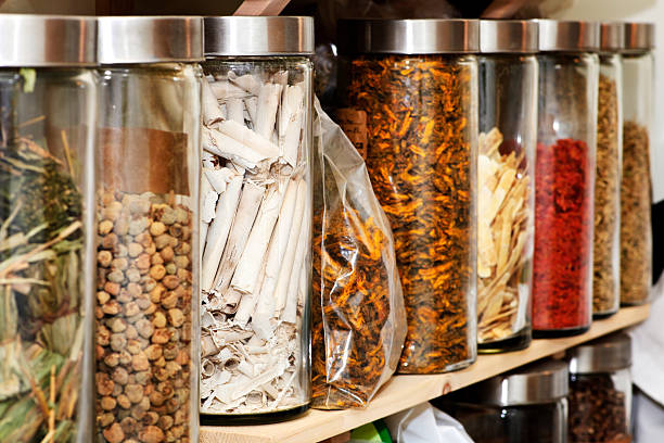 Traditional Chinese herbal medicines Traditional chinese medicine herbs and remedies in jars chinese herbal medicine stock pictures, royalty-free photos & images