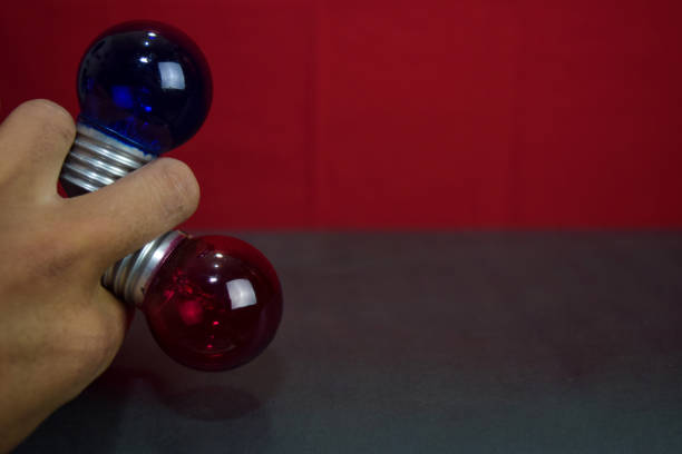 istock Close up lamp in red background and black table 1143385854