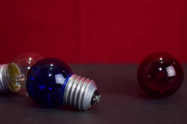 Idea concept with broken bulbs and one glowing bulb