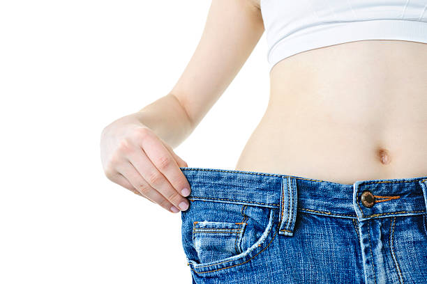 istock Woman showing weight loss 114338824