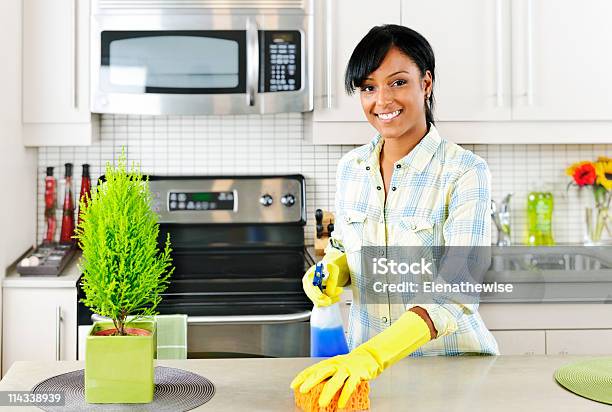 Young Woman Cleaning Kitchen Stock Photo - Download Image Now - African Ethnicity, Cleaning, One Woman Only