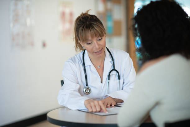 istock Doctor speaking to patient 1143390272