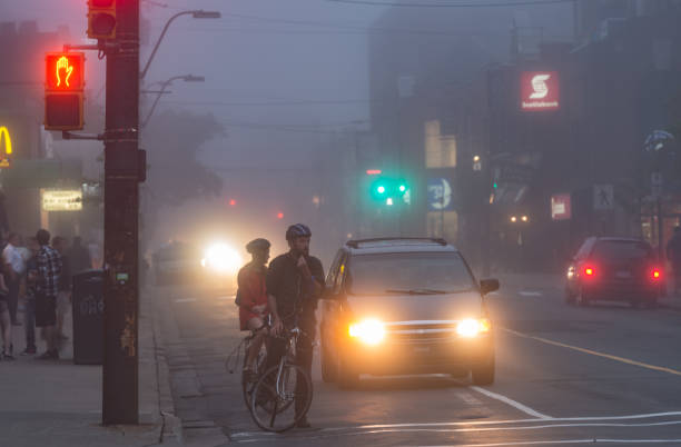 Traffic in the city on a misty early morning