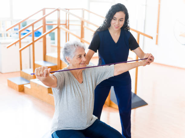 istock Senior patient stretching with elastic band 1143400919