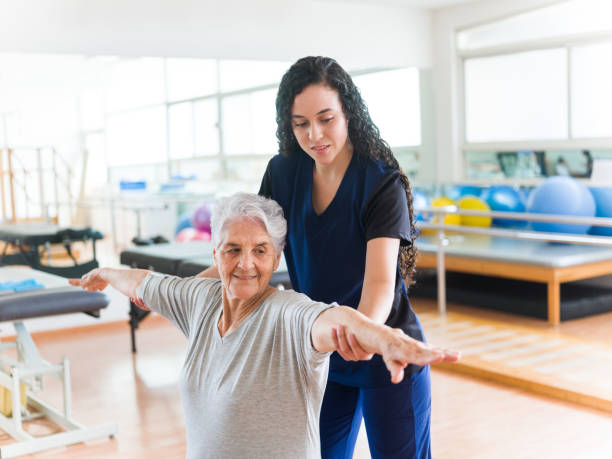 istock Senior patient stretching her arms 1143400934