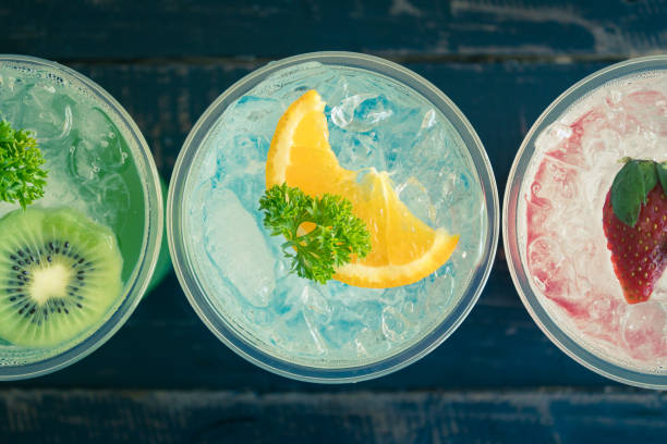 Green Blue Red Italian Soda Cold Beverage and Kiwi Lemon Strawberry Fruit Close Up Vintage