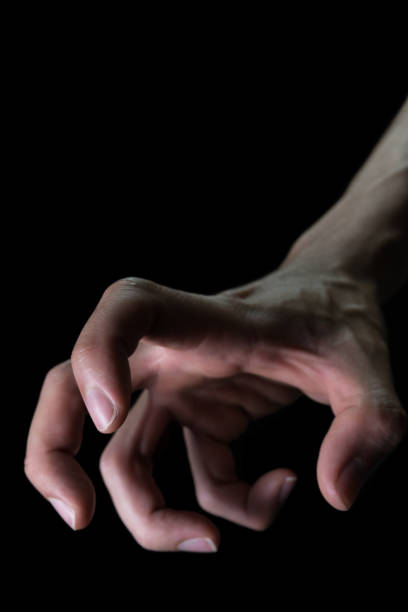 istock Upside Down Human Hand for Devil Crime Violence Concept in Book Cover Style 1143409105