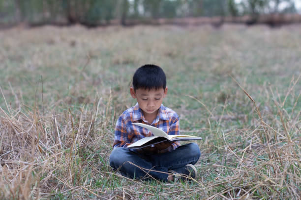 istock Children who are interested in staring at books. 1143409416