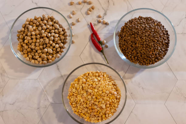 istock chickpeas lentils and peas in transparent plates with pepper on a light background 1143414708