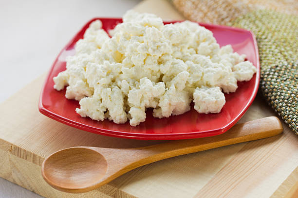 istock cream sour, cottage in a plate isolated white backround 1143418800