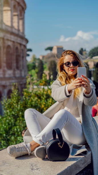 istock Blonde girl taking selfie in Rome 1143420759