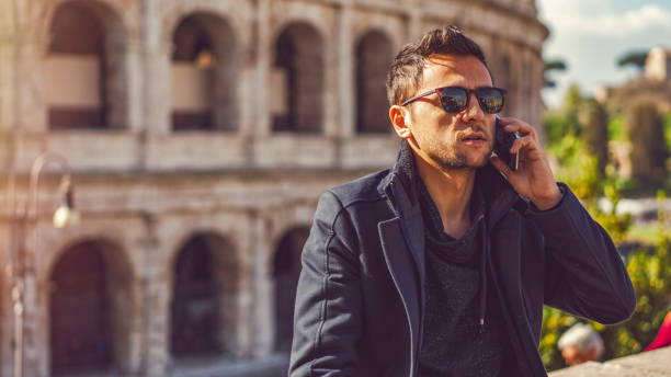 istock Man talking by phone in Rome 1143420856