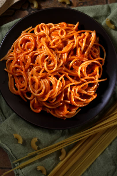 istock Freshly cooked spaghetti pasta with tomato sauce on a plate 1143424343