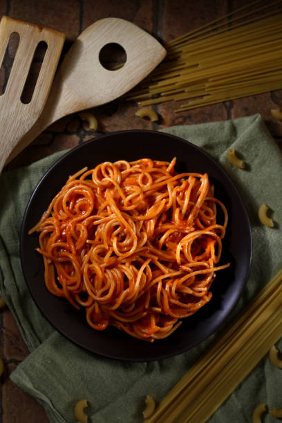 istock Freshly cooked spaghetti pasta with tomato sauce on a plate 1143425017