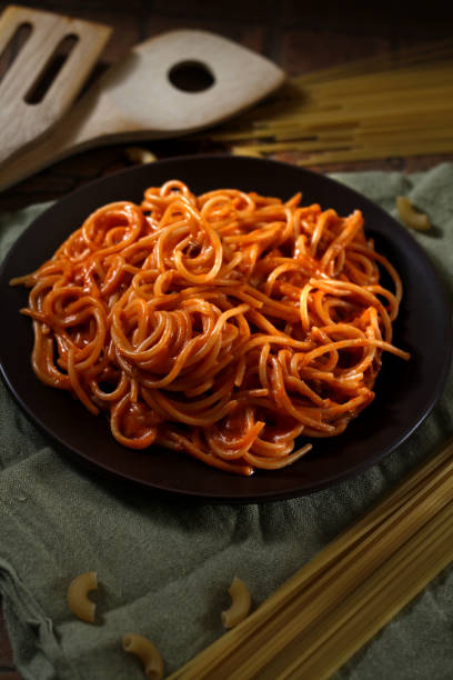 istock Freshly cooked spaghetti pasta with tomato sauce on a plate 1143425376