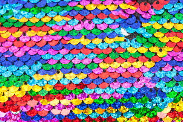 istock Pattern made of colorful rainbow sequins. 1143427338