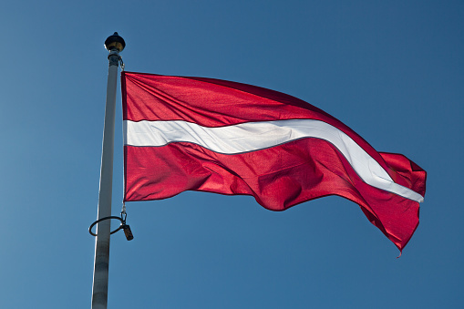 The Flag of Latvia waving in the wind