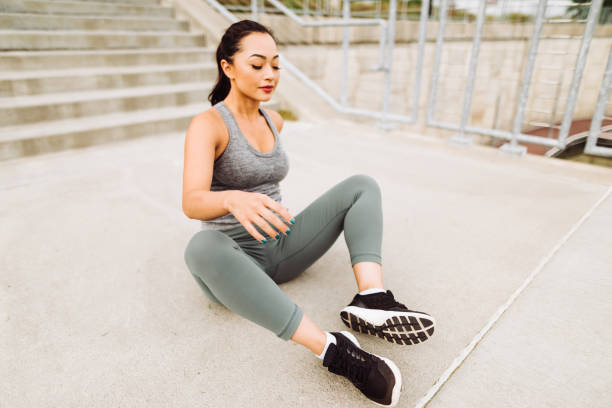 istock fitness woman resting on the steps 1143428194
