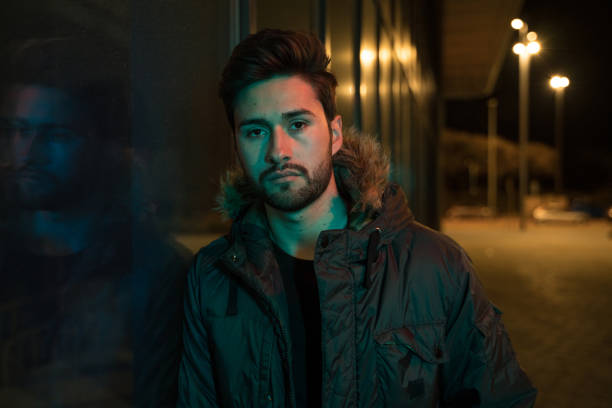 istock Cool young man downtown at night 1143429898
