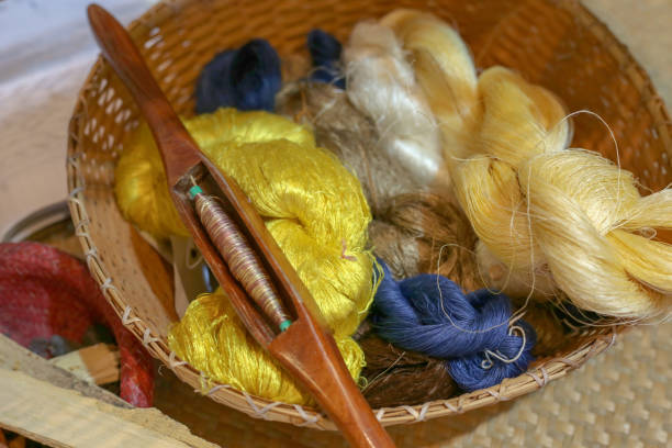 istock The Mudmee Silk is a fabric where pattern or design has to be made before  the dyeing process. Silk lines that are naturally dyed with organic processes. Thailand. 1143432314