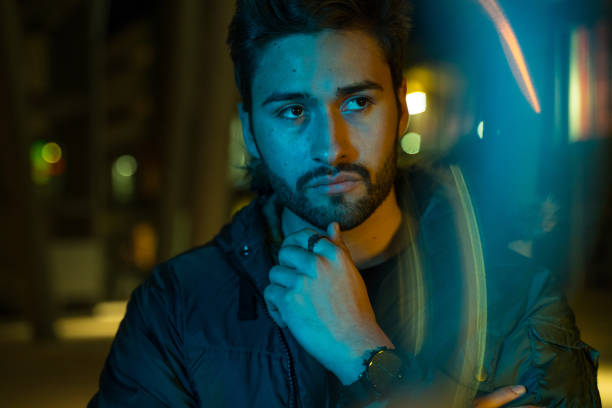 istock Young man in the city at night 1143432609