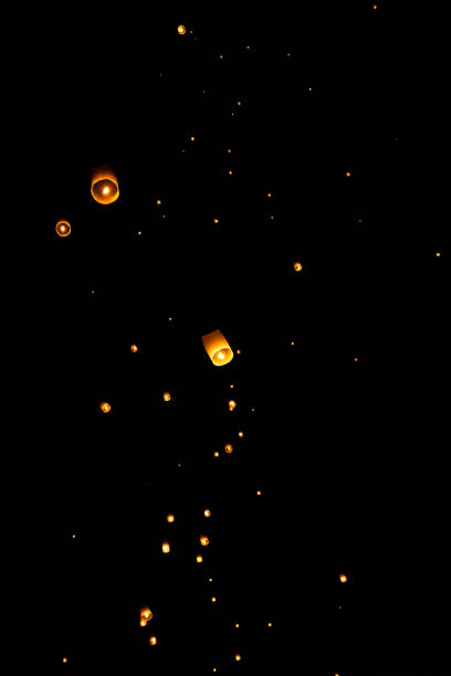 istock Loi Krathong and Yi Peng released paper lanterns on the sky during night 1143434038