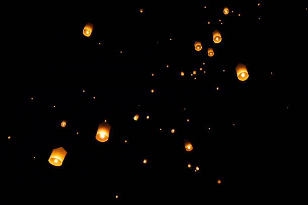 istock Loi Krathong and Yi Peng released paper lanterns on the sky during night 1143434071