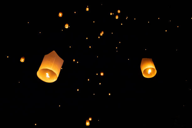 istock Loi Krathong and Yi Peng released paper lanterns on the sky during night 1143434082