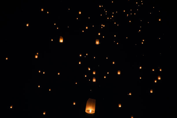 istock Loi Krathong and Yi Peng released paper lanterns on the sky during night 1143434130