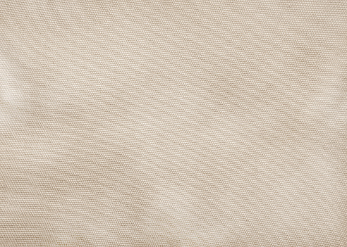Tela de algodón sepia marrón textura tejida con fondo de patrón gris. Diseño de saco de lino de enfoque suave. photo